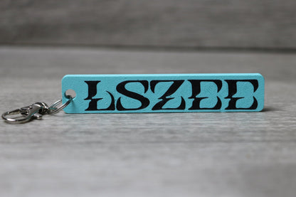 LSZEE Keychain – EDM Rave Charm for Festival Bags, Basshead DJ Fan Gift, Cute LSZEE Merch Collectible for Headbangers